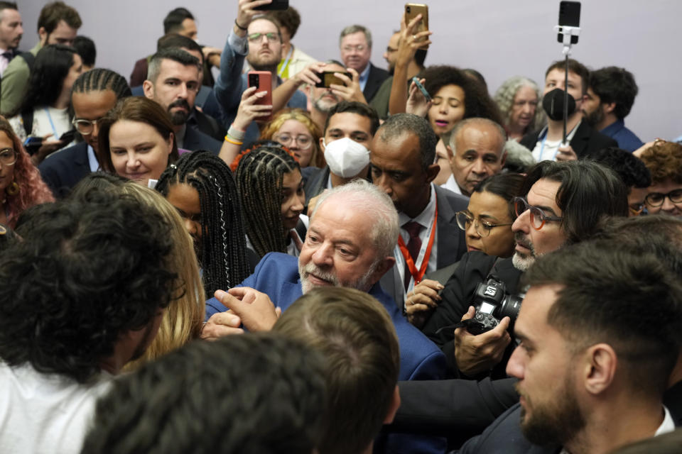 Brazilian President-elect Luiz Inacio Lula da Silva, center, leaves after speaking at a meeting with youth activists at the COP27 U.N. Climate Summit, Thursday, Nov. 17, 2022, in Sharm el-Sheikh, Egypt. (AP Photo/Peter Dejong)