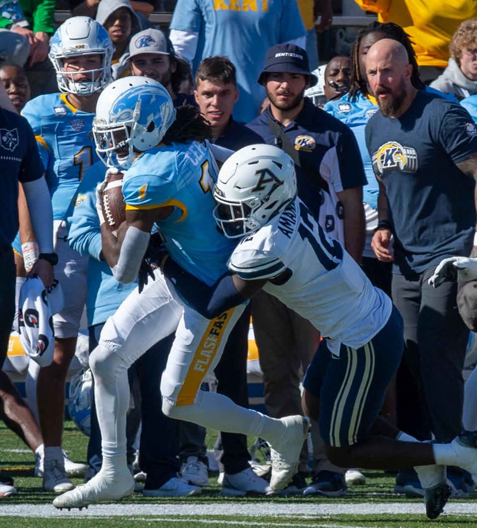 Kent State receiver Dante Cephas is tackled by Akron's Charles Amankwaa, Saturday, Oct. 22, 2022, in Kent.