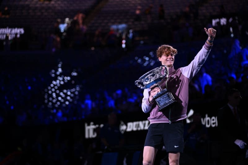 Italian tennis player Jannik Sinner poses with the Norman Brookes Challenge Cup following his victory over Russia's Daniil Medvedev in the Men’s Singles final tennis match of the 2024 Australian Open at Melbourne Park. Joel Carrett/AAP/dpa