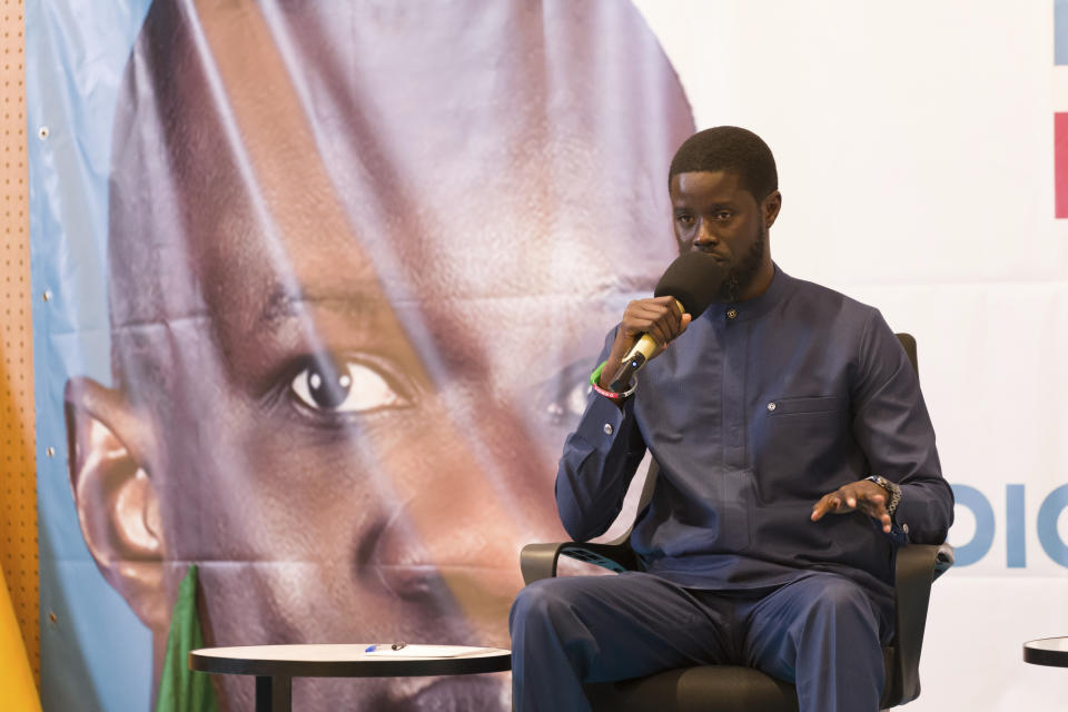 Senegal's opposition presidential candidate Bassirou Diomaye Faye addresses supporters in Dakar, Senegal, Thursday, March 14, 2024. He and opposition leader Ousmane Sonko were released from prison earlier in the day. (AP Photo/Sylvain Cherkaoui)