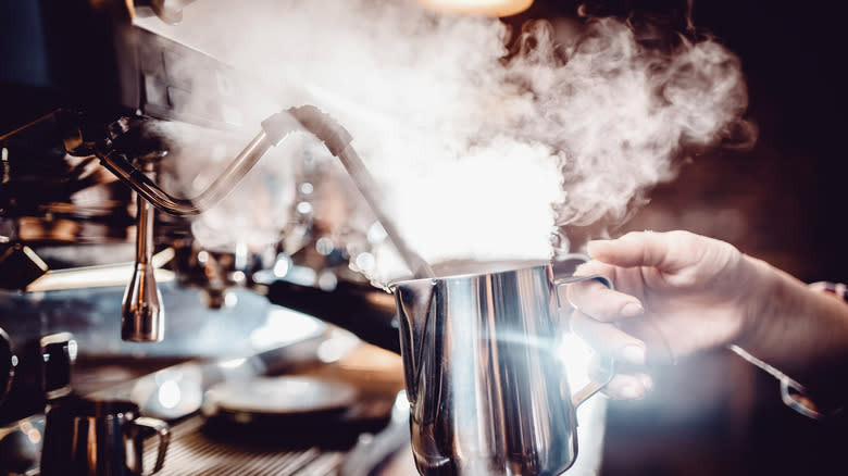 Steaming milk in pitcher