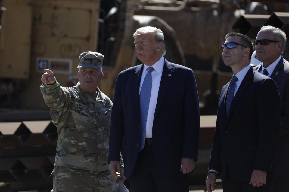 President Donald Trump tours a section of the southern border wall, Wednesday, Sept. 18, 2019, in Otay Mesa, Calif,. with the Commanding General of the Army Corps of Engineers Lt. Gen. Todd Semonite, left, acting commissioner of Customs and Border Protection Mark Morgan, far right and acting Homeland Secretary Kevin McAleenan. (AP Photo/Evan Vucci)