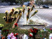 <p>Roses are seen on a fence line outside Marjory Stoneman Douglas High School , Feb. 19, 2018 in Parkland, Fla. (Photo: Mindy Katzman/Yahoo News) </p>