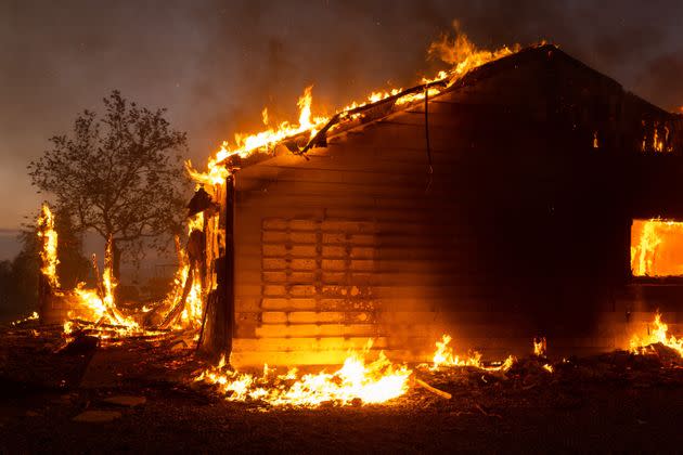 A property burns in Riverside County amid the intense heat wave. (Photo: VCG via Getty Images)