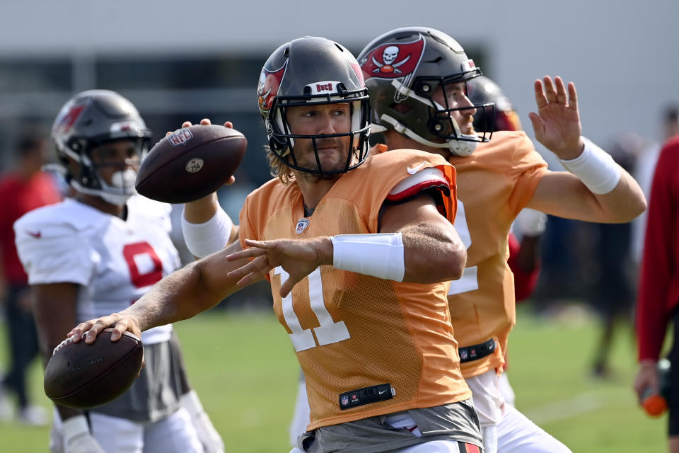 Tampa Bay Buccaneers quarterback's Blaine Gabbert (11) and Kyle Trask, right, take part in drills during a combined NFL football training camp with the Tennessee Titans Wednesday, Aug. 17, 2022, in Nashville, Tenn. (AP Photo/Mark Zaleski)