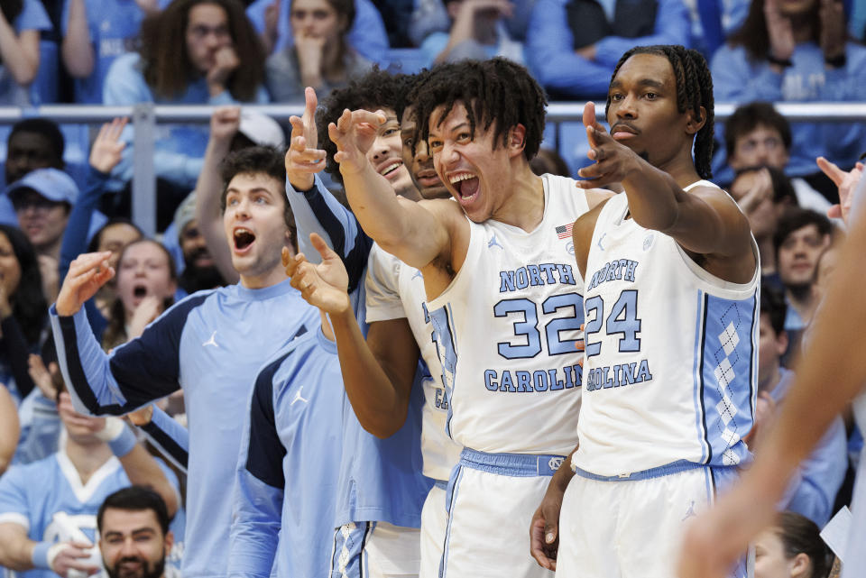 North Carolina's Jae'Lyn Withers (24) and James Okonkwo (32) react to a play during the second half of an NCAA college basketball game in Chapel Hill, N.C., Saturday, Feb. 17, 2024. (AP Photo/Ben McKeown)