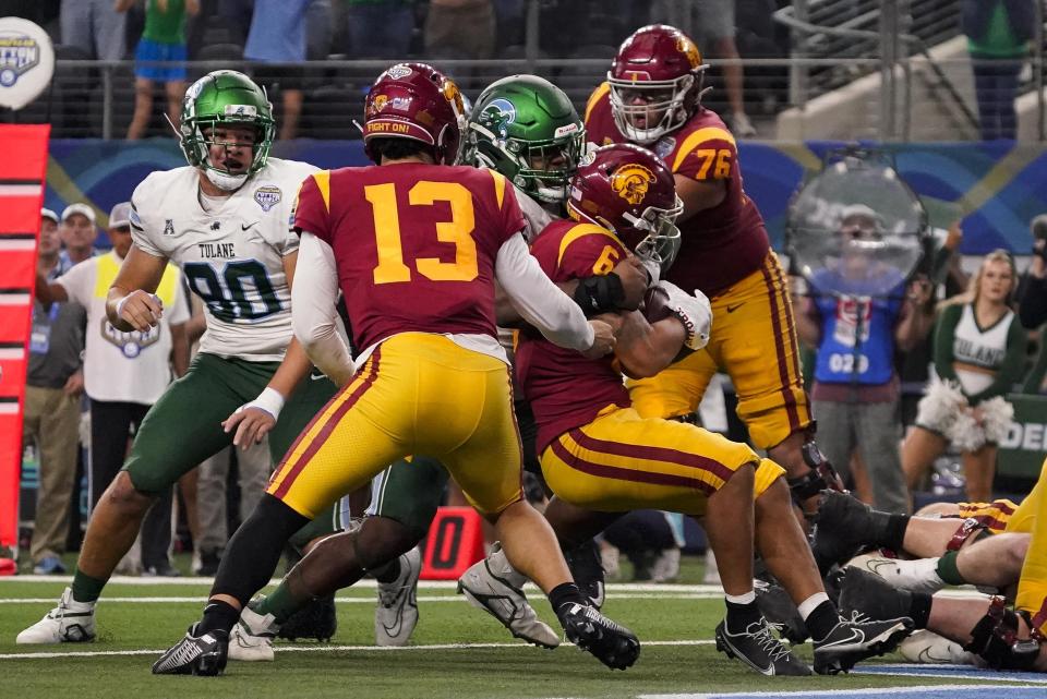 Southern California running back Austin Jones (6) is tackled in the end zone for a safety during the second half of the Cotton Bowl NCAA college football game against Tulane, Monday, Jan. 2, 2023, in Arlington, Texas. (AP Photo/Sam Hodde)