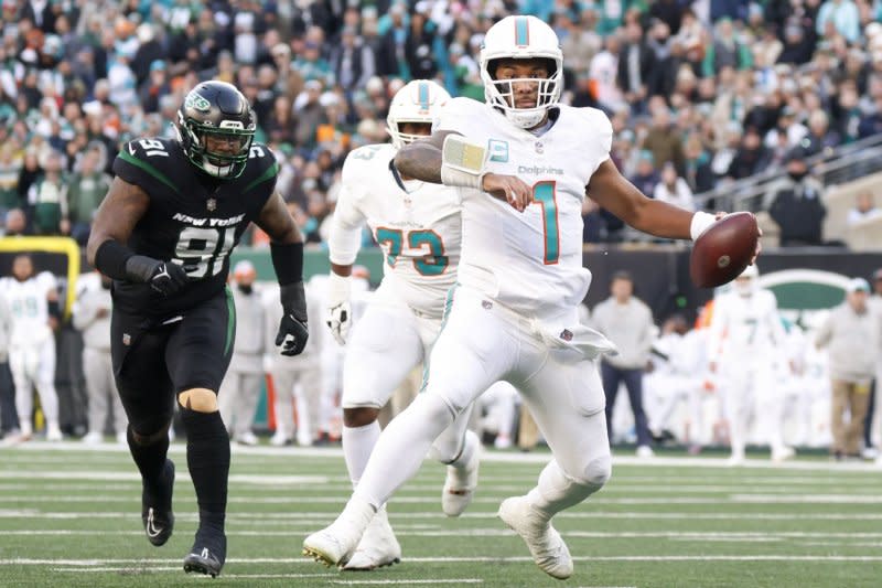 Miami Dolphins offensive tackle Austin Jackson (C) allowed two sacks through 12 starts this season, while protecting quarterback Tua Tagovailoa (R). File Photo by John Angelillo/UPI