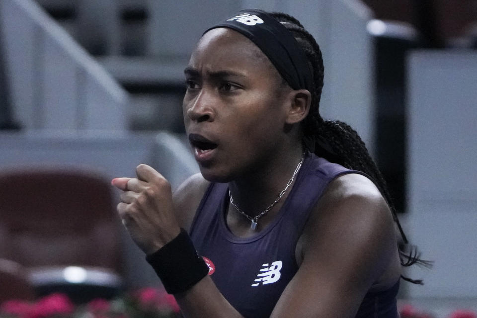 Coco Gauff of the United States reacts after scoring a set point against Ekaterina Alexandrova of Russia during the first round of the women's singles match in the China Open tennis tournament at the Lotus Court in Beijing, Monday, Oct. 2, 2023. (AP Photo/Andy Wong)