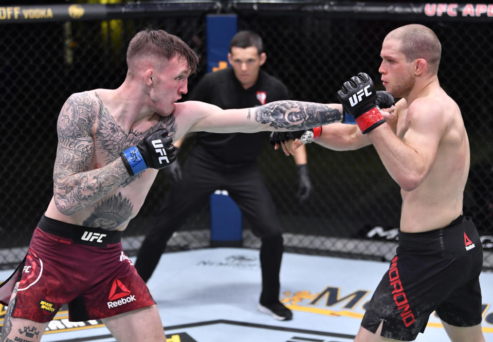 LAS VEGAS, NEVADA – NOVEMBER 14: (L-R) Rhys McKee of Northern Ireland punches Alex Morono in a welterweight fight during the UFC Fight Night event at UFC APEX on November 14, 2020 in Las Vegas, Nevada. (Photo by Jeff Bottari/Zuffa LLC)