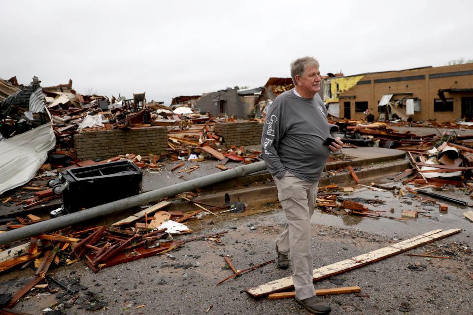 Charlie Schwake walks past his property in Sulphur after a tornado hit the area the night before in Sulphur, Okla., Sunday, April 28, 2024. (Bryan Terry/The Oklahoman via AP)