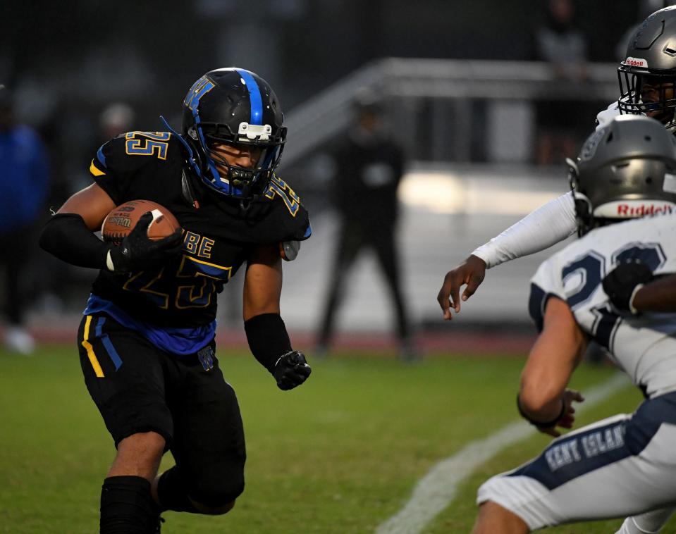 Wi-Hi's Aiden Farmer (25) rushes against Kent Island Thursday, Sept. 28, 2023, at Wicomico County Stadium in Salisbury, Maryland. Kent Island defeated Wi-Hi 28-0.