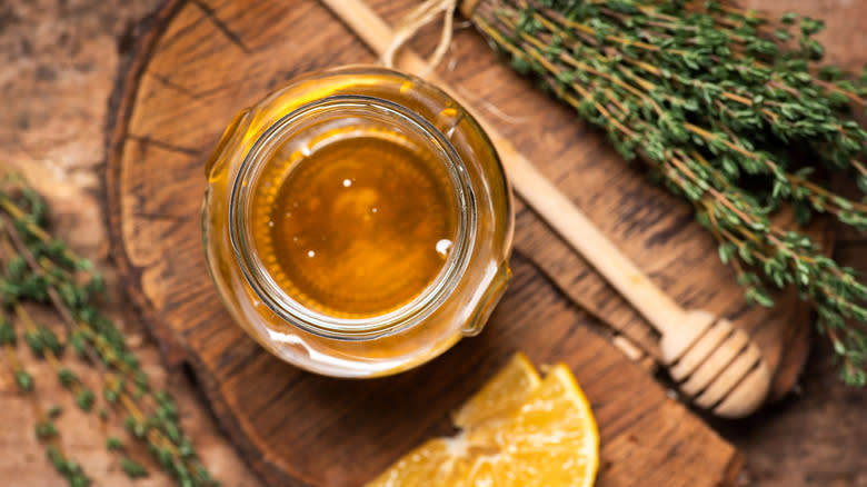 Jar of honey with thyme