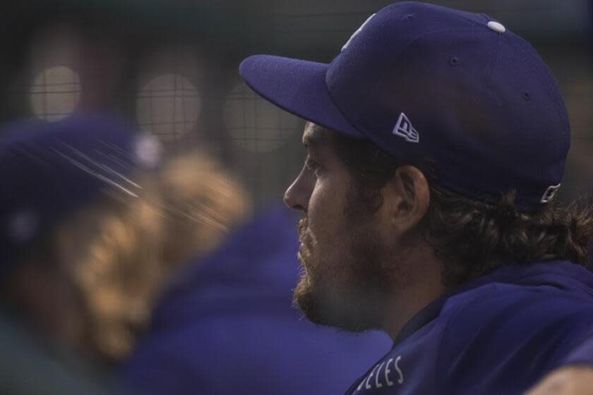 Dodgers pitcher Trevor Bauer looks on from the dugout during a game against the Washington Nationals on July 1, 2021.