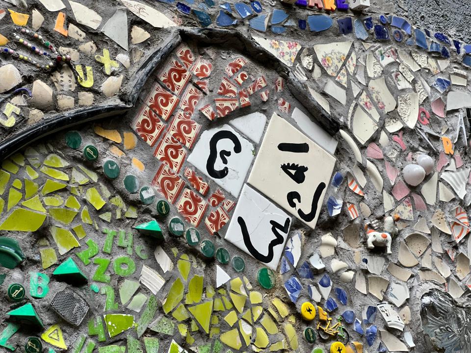 A close up of a mosaic along the Burlington bike path at the Rock Point Rd. underpass as seen on Aug. 3, 2023. The mixed-media creation from Mary Lacy and Corrine Yonce depicts verses from "On Disappearing" by Major Jackson.