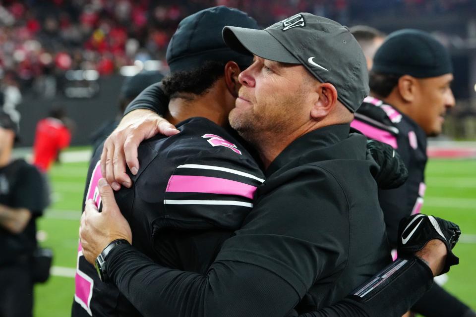 Oct 21, 2023; Paradise, Nevada, USA; UNLV Rebels head coach Barry Odom embraces UNLV Rebels quarterback Cameron Friel (7) after the Rebels defeated the Colorado State Rams 22-20 at Allegiant Stadium.