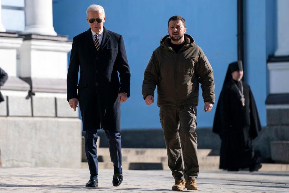 President Biden walks with Ukrainian President Volodymyr Zelenskyy at St. Michael's Golden-Domed Cathedral during an unannounced visit in Kyiv on Feb. 20, 2023. / Credit: EVAN VUCCI/POOL/AFP via Getty Images