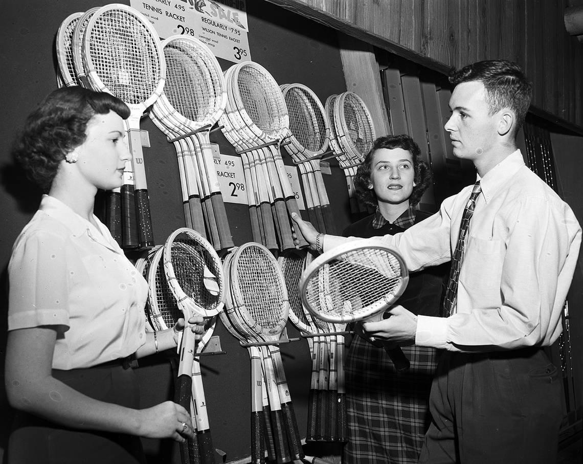 Oct. 10, 1952: Jimmy Little from Arlington Heights, who works in sporting goods at Leonard’s Department Store, describes his work to two other student employees, Frances Spruill from North Side, and Bonnie Key of Paschal.