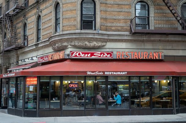 PHOTO: With food prices increasing overall by 30-40 percent, the Westside Restaurant hangs a copy of their menu on a window rather than permanently mounting it; it’s easier that way for when prices change according to the owner. (ABC News)