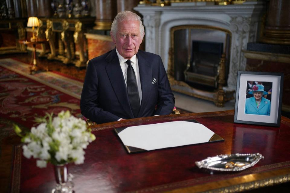TOPSHOT - Britain's King Charles III makes a televised address to the Nation and the Commonwealth from the Blue Drawing Room at Buckingham Palace in London on September 9, 2022, a day after Queen Elizabeth II died at the age of 96. - Queen Elizabeth II, the longest-serving monarch in British history and an icon instantly recognisable to billions of people around the world, died at her Scottish Highland retreat on September 8. (Photo by Yui Mok / POOL / AFP) (Photo by YUI MOK/POOL/AFP via Getty Images)