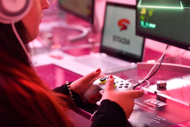 A visitor plays a cloud-game at the stand of Google Stadia during the Video games trade fair Gamescom in Cologne, western Germany, on August 21, 2019. (Photo by Ina FASSBENDER / AFP)        (Photo credit should read INA FASSBENDER/AFP via Getty Images)