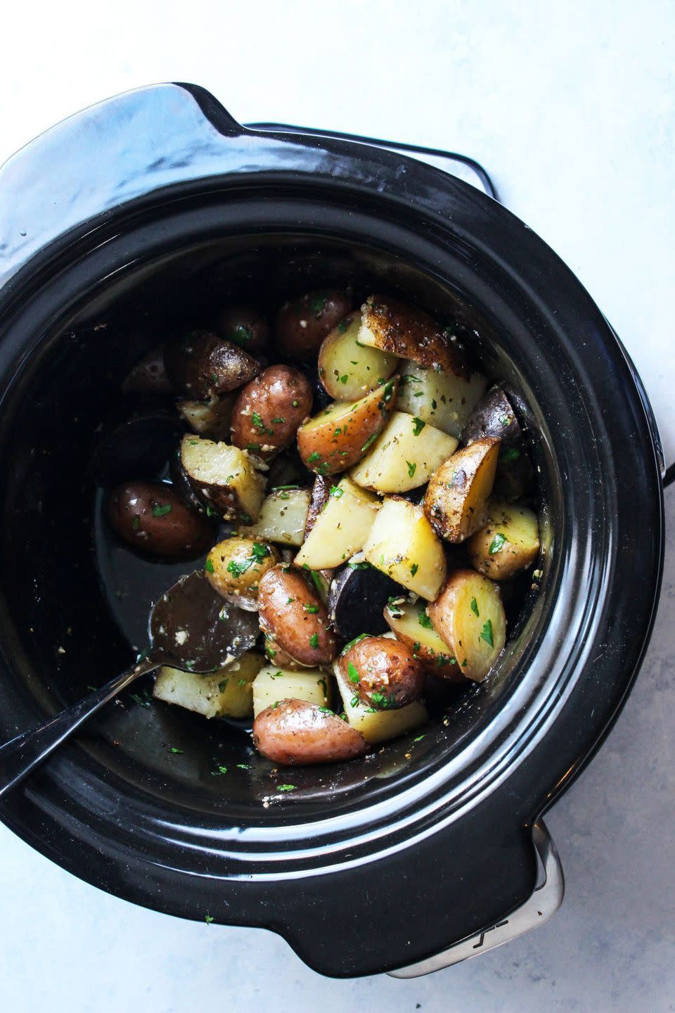 <p>Potatoes are a go-with-anything side dish. Make a big batch extra flavorful with this delicious buttery recipe.</p><p><strong>Get the recipe for <a href="https://cleanfoodiecravings.com/slow-cooker-garlic-herb-potatoes-2/" rel="nofollow noopener" target="_blank" data-ylk="slk:Slow Cooker Garlic Herb Potatoes" class="link ">Slow Cooker Garlic Herb Potatoes</a> at Clean Foodie Cravings.</strong> </p>