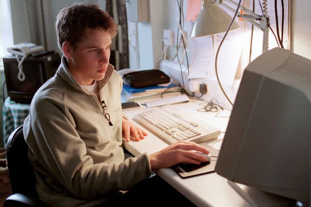 <p>Tim Graham Photo Library via Getty</p> Prince William on his computer at Eton College