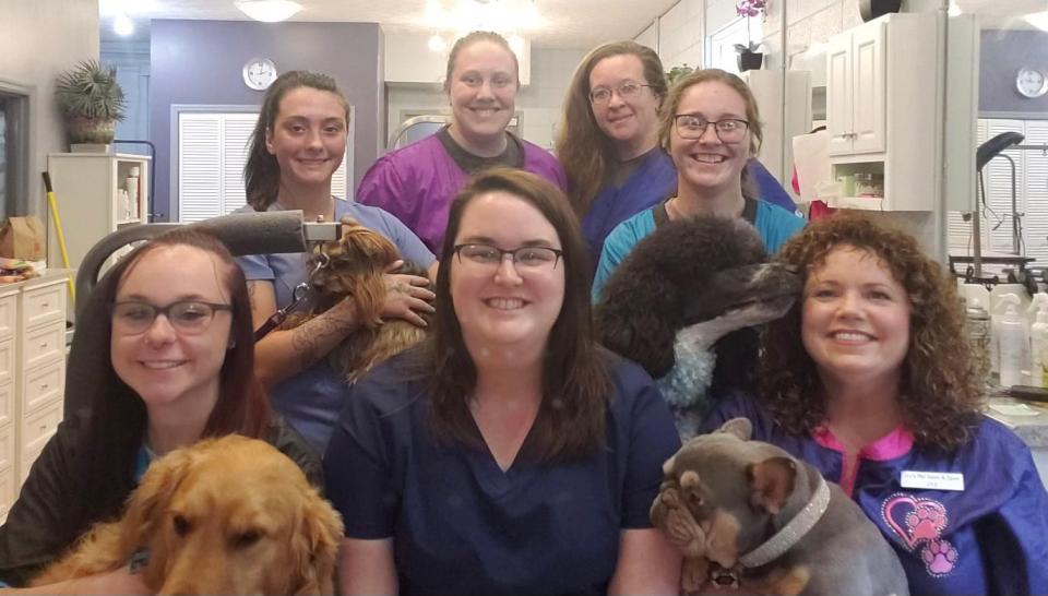 The staff at Joy's Pet Salon & Spaw enjoy their work. They are (back, from left) Brooke Williams with T-Bone, Taylor Chan, Christy Brown and Destiny Johnson with Astro. (Front, from left) Kenzie Walker with Boomer, Ceria Hall and Joy Whitt with GiGi. Belle Whitson is not pictured.