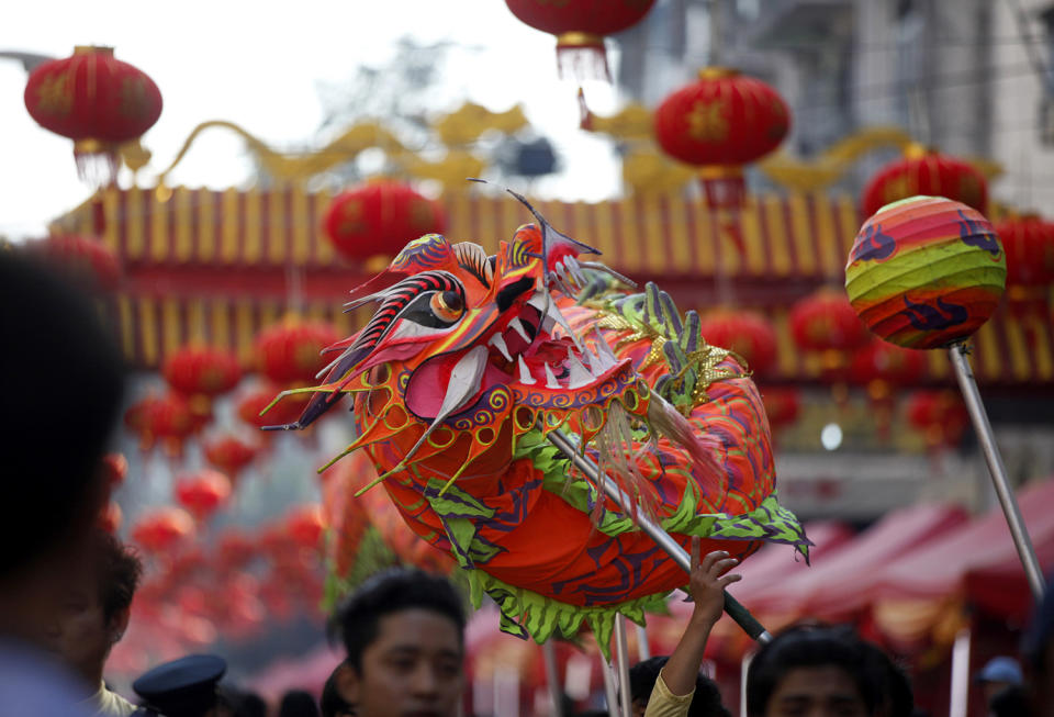 Local Chinese artists perform a dragon dance during celebrations to mark Lunar New Year at Chinatown Saturday, Jan. 28, 2017, in Yangon, Myanmar. Saturday marks the Year of the Rooster in the Chinese calendar. (AP Photo/Thein Zaw)