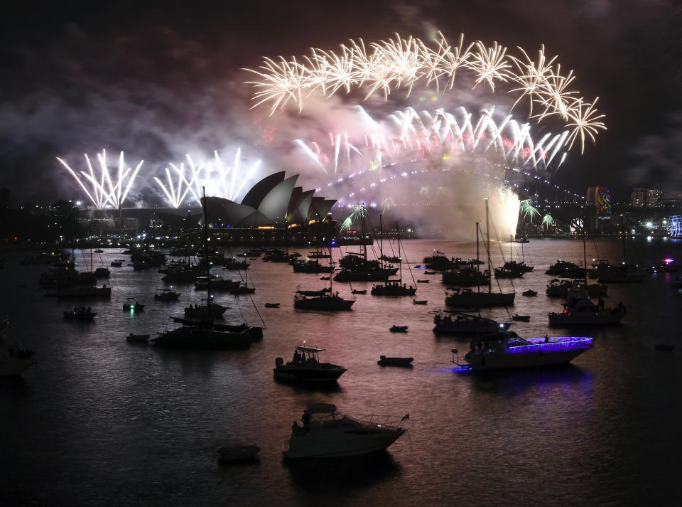 <p>Fireworks explode over Sydney Harbour during New Year’s Eve celebrations in Sydney, Monday, Jan. 1, 2018. (Photo: David Moir/AP) </p>