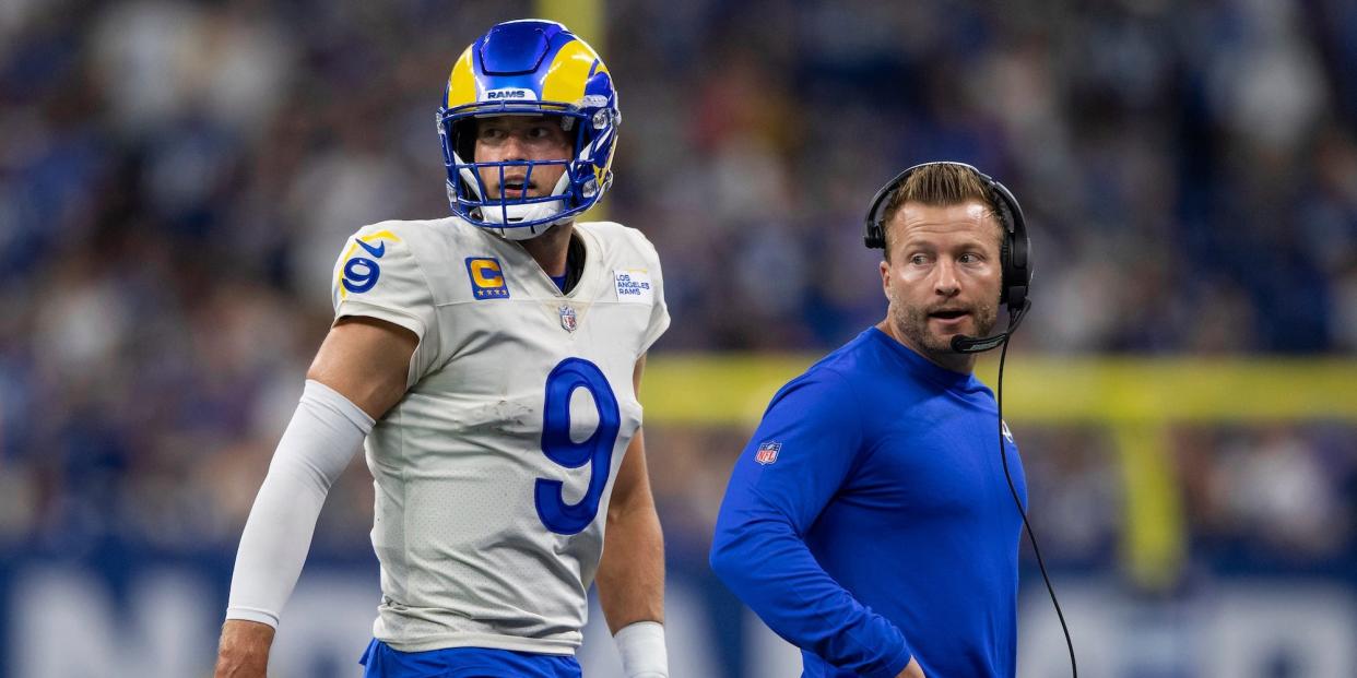 Matthew Stafford and Sean McVay look on while walking off the field during a Rams game.