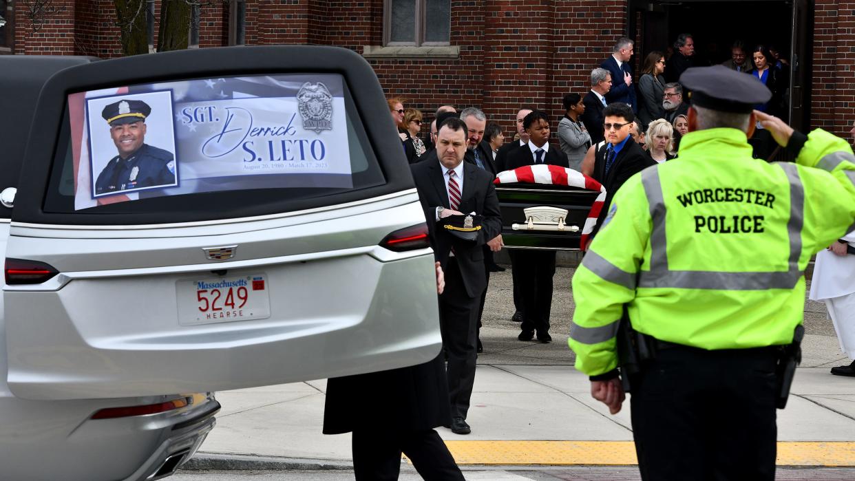 Worcester Police Sgt. Derrick Leto's casket is brought out after a funeral Mass was held at St. Stephen Church on Grafton Street Friday.