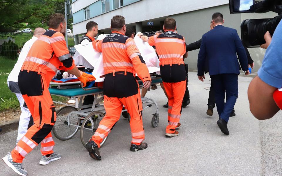 Slovak Prime Minister Robert Fico being transported by medics and his security detail to a hospital in Slovakia after the shooting