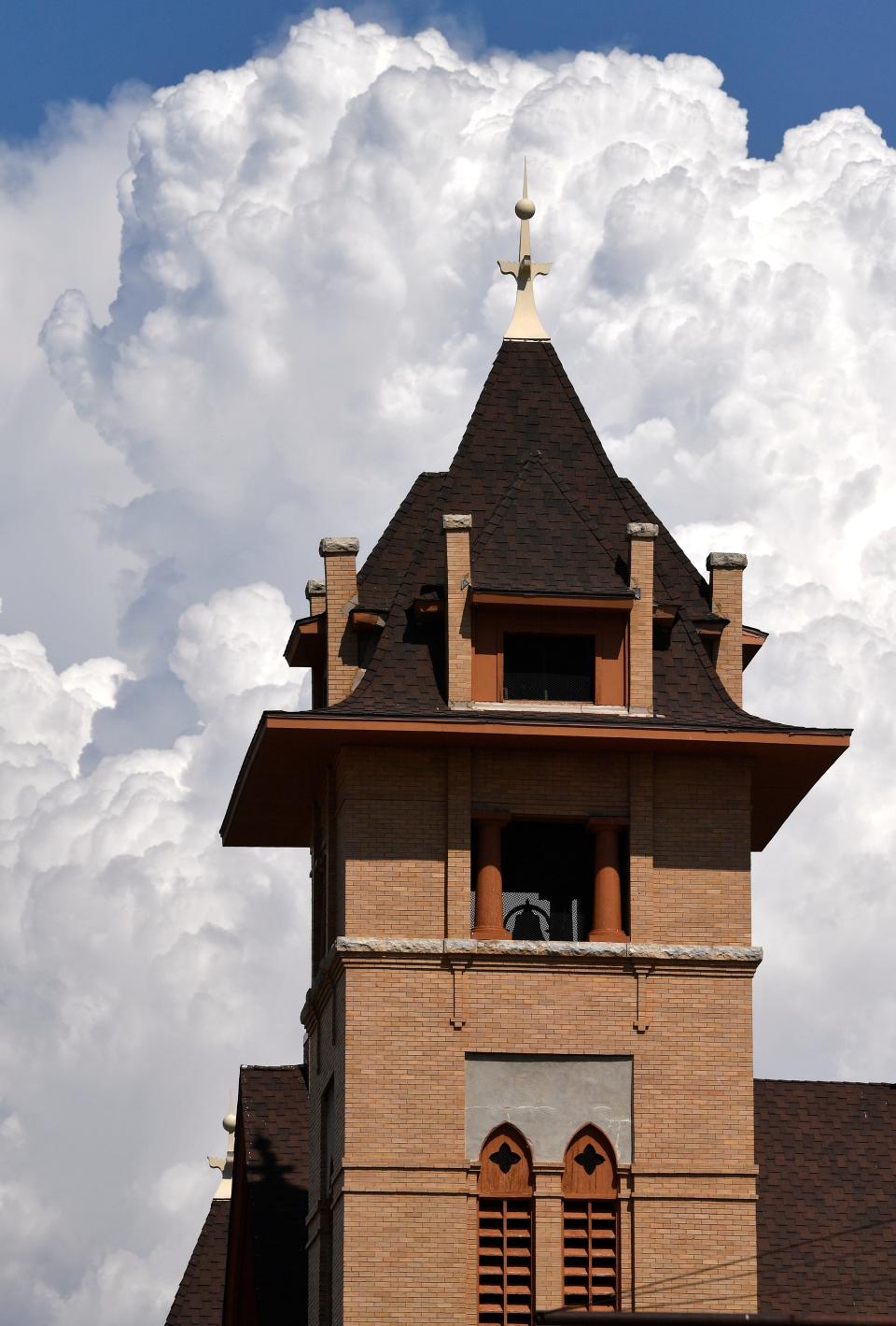 The steeple of St. John’s Methodist Church in Stamford is set off by clouds building behind it August 20.