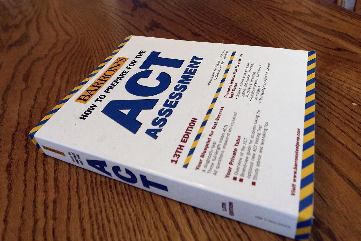 In this Tuesday, April 1, 2014 photo, an ACT Assessment preparation book is seen in Springfield, Ill. (AP Photo/Seth Perlman)