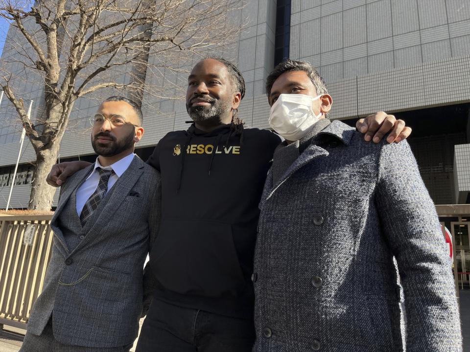 Syed Zain, left, and other plaintiffs of a lawsuit filed in Tokyo District Court stand together in front of the Tokyo District Courthouse in Tokyo Monday, Jan. 29, 2024. A civil lawsuit filed Monday in the Japanese court is demanding an end to what it calls racial profiling by police.(AP Photo/Yuri Kageyama)