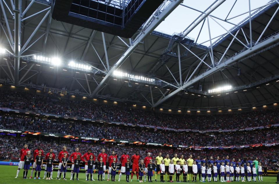 <p>Ajax players take part in a minutes silence in memory of the victims of the Manchester Concert attack prior to the UEFA Europa League Final between Ajax and Manchester United at Friends Arena on May 24, 2017 in Stockholm, Sweden. </p>