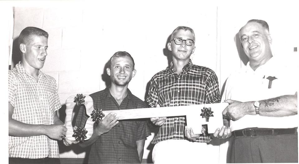 John Studer, Mayor of Strasburg, at right, presents Terry Spidell, left, Jim Ecenbarger, center, and Bill Malcuit with the key to the city.