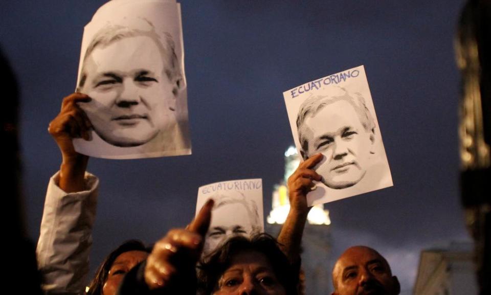 Assange supporters demonstrate outside the presidential palace in Quito, Ecuador