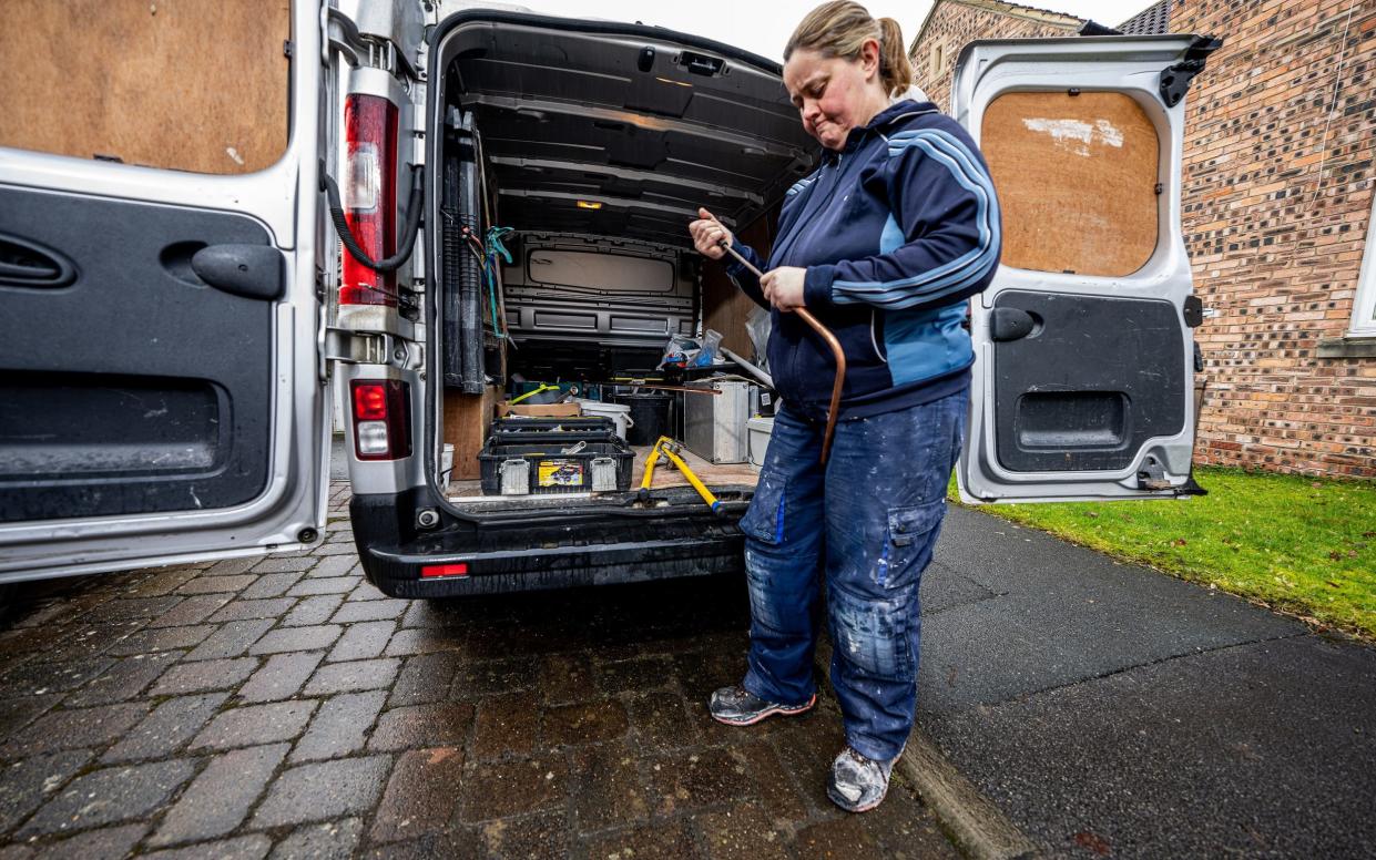 Helen Burnley of HB Plumbing with her work van out on a job. There is concern that plumbers are not a diverse-enough workforce - The Telegraph/Charlotte Graham