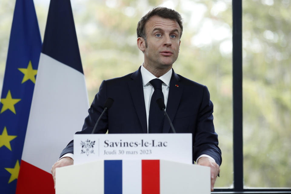 French President Emmanuel Macron delivers a speech in Sainte-Savine-Le-Lac, southeastern France, Thursday, March 30, 2023. Emmanuel Macron presented a plan for saving France's water after exceptional winter drought, February wildfires and violence between protesters and police over an agricultural reservoir. (Sebastien Nogier, Pool via AP)