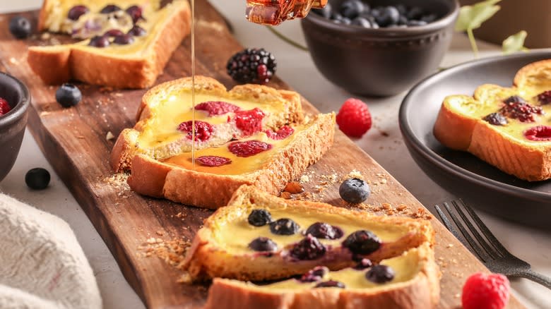 Yogurt toast with berries and honey drizzling