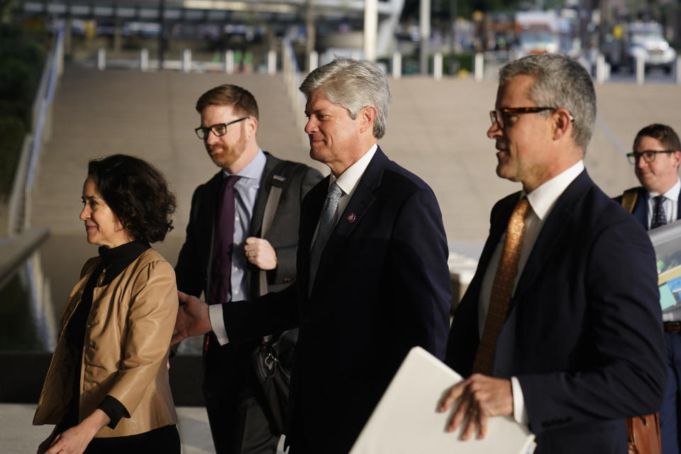 U.S. Rep. Jeff Fortenberry, R-Neb., center, and wife, Celeste, arrive at the federal courthouse in Los Angeles, Wednesday, March 16, 2022. Fortenberry stands trial starting Wednesday to fight allegations that he lied to federal investigators about an illegal 2016 contribution to his campaign from a foreign national and didn't properly disclose it in campaign filings. (AP Photo/Jae C. Hong)