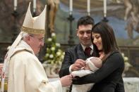 Pope Francis baptises one of 32 babies during a mass in the Sistine Chapel at the Vatican January 12, 2014, in this handout courtesy of Osservatore Romano. REUTERS/Osservatore Romano/Handout via Reuters (VATICAN - Tags: RELIGION) ATTENTION EDITORS - THIS IMAGE WAS PROVIDED BY A THIRD PARTY. FOR EDITORIAL USE ONLY. NOT FOR SALE FOR MARKETING OR ADVERTISING. THIS PICTURE IS DISTRIBUTED EXACTLY AS RECEIVED BY REUTERS, AS A SERVICE TO CLIENTS. NO SALES. NO ARCHIVES