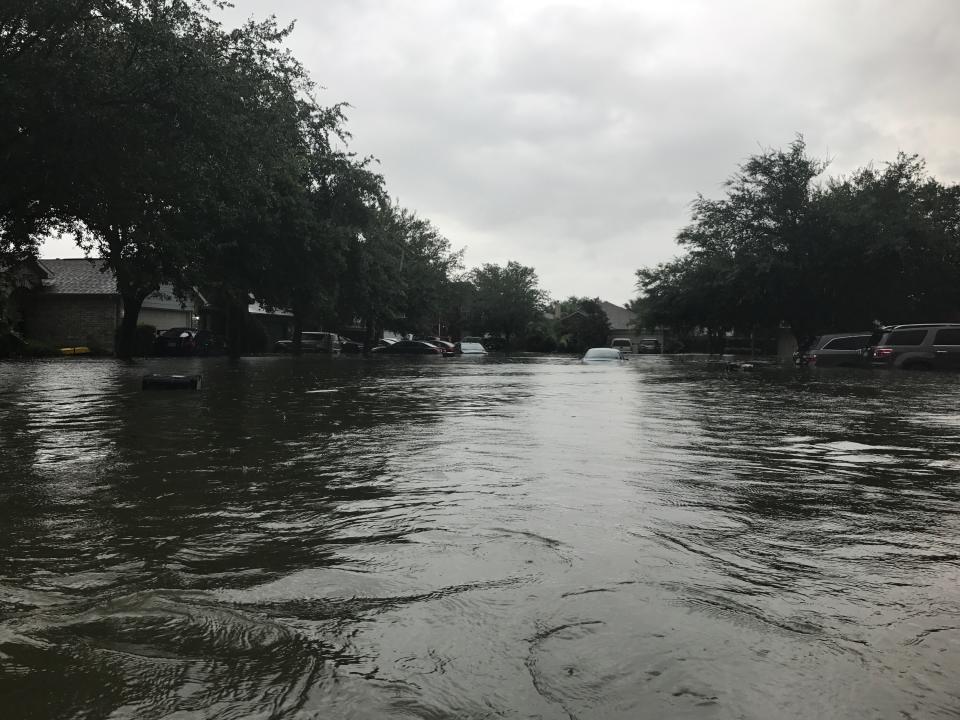 The Rochas waded through this street to get to safety on August 27. The three kids wore life preservers. Photo courtesy of Ashley Rocha.