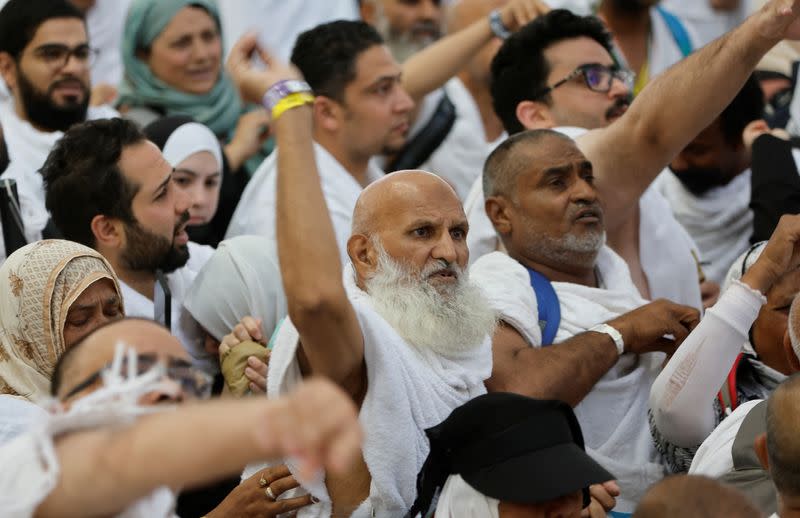 Muslim pilgrims cast their stones at a pillar symbolising the stoning of Satan during the annual Haj pilgrimage in Mina