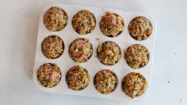 Raw turkey meatloaf in muffin tin