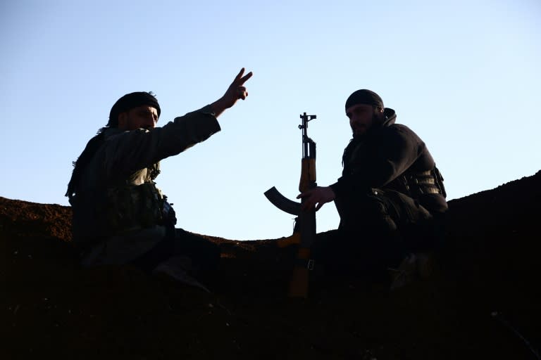 Turkey-backed fighters of the Free Syrian Army hold a position in the Tal Malid area north of Aleppo as they prepare to target Kurdish YPG positions in the Afrin area on January 20, 2018