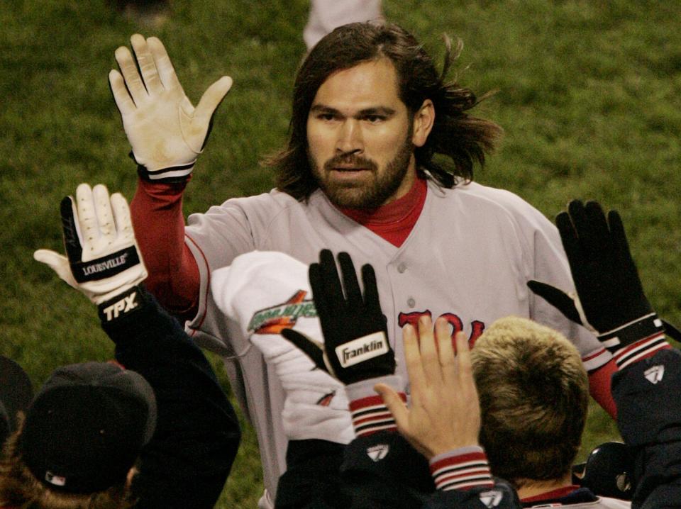 Boston's Johnny Damon celebrates his two-run home run against the New York Yankees in Game 7 of the American League Championship Series.