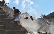 <p>Rescuers work at a collapsed building following an earthquake in Amatrice, central Italy, Aug. 24, 2016. (REUTERS/Emiliano Grillotti) </p>